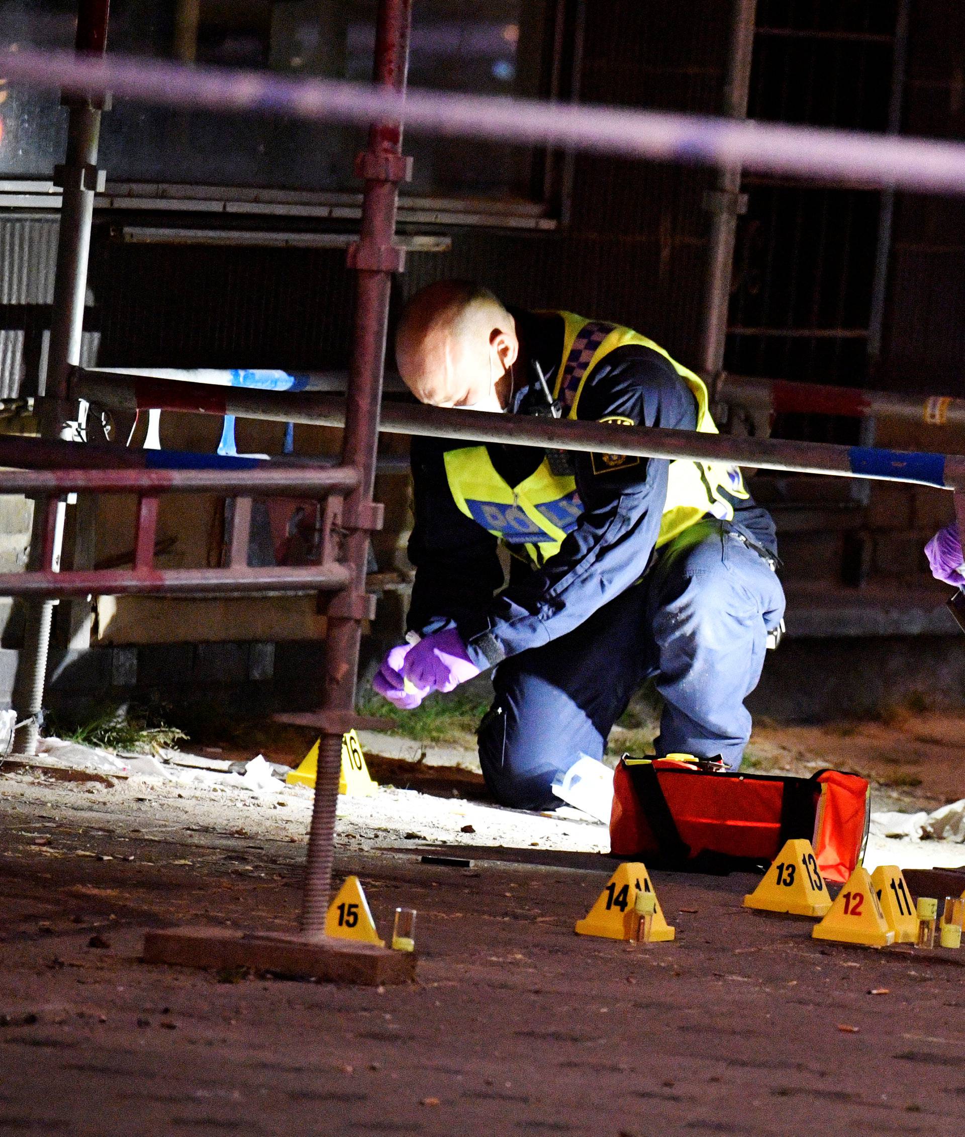 Police forensics search area after a shooting on a street in central Malmo