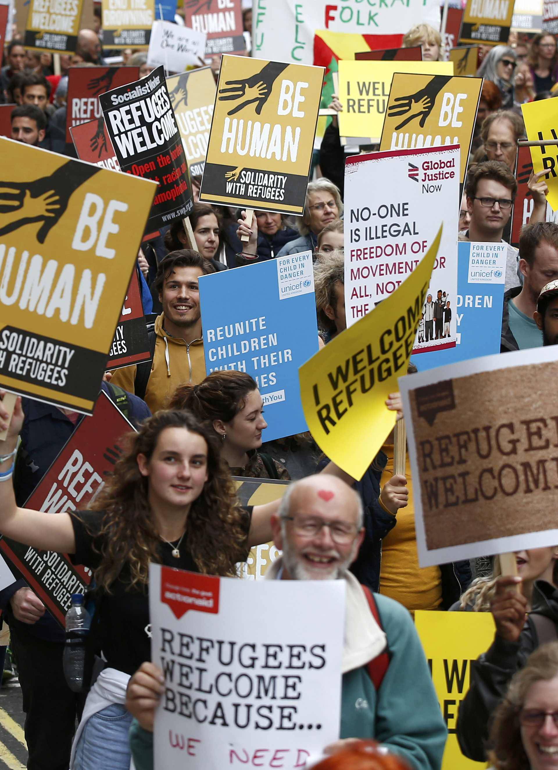 Demonstrators including refugees march to the Houses of Parliament during a protest in support of refugees, in London