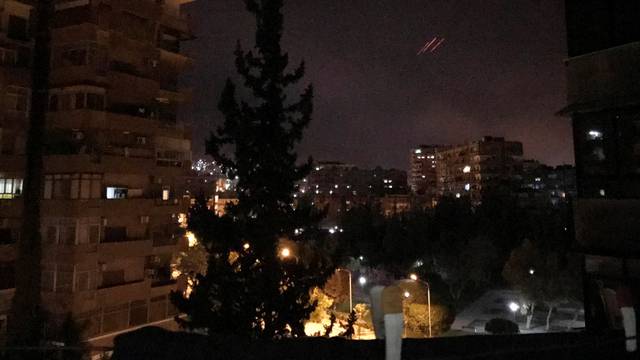 Anti-aircraft fire is seen over Damascus,Syria