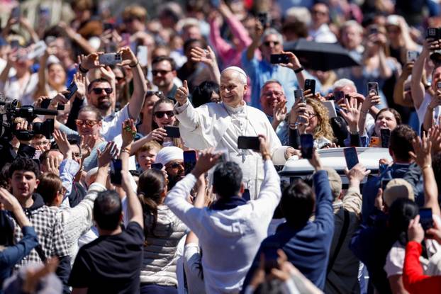Pope Leo XIV delivers his "Urbi et Orbi" (To the city and the world) message from the main balcony of St. Peter's Basilica
