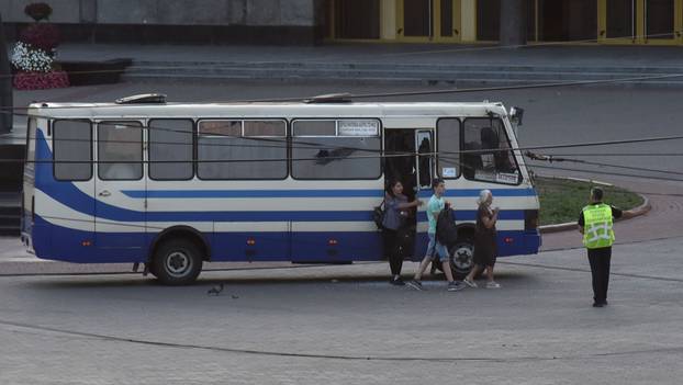 Three hostages walk out of a seized passenger bus in Lutsk