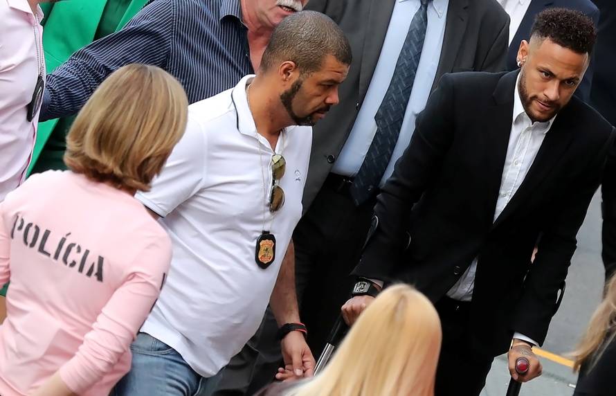 Brazilian soccer player Neymar arrives at a police station in Sao Paulo