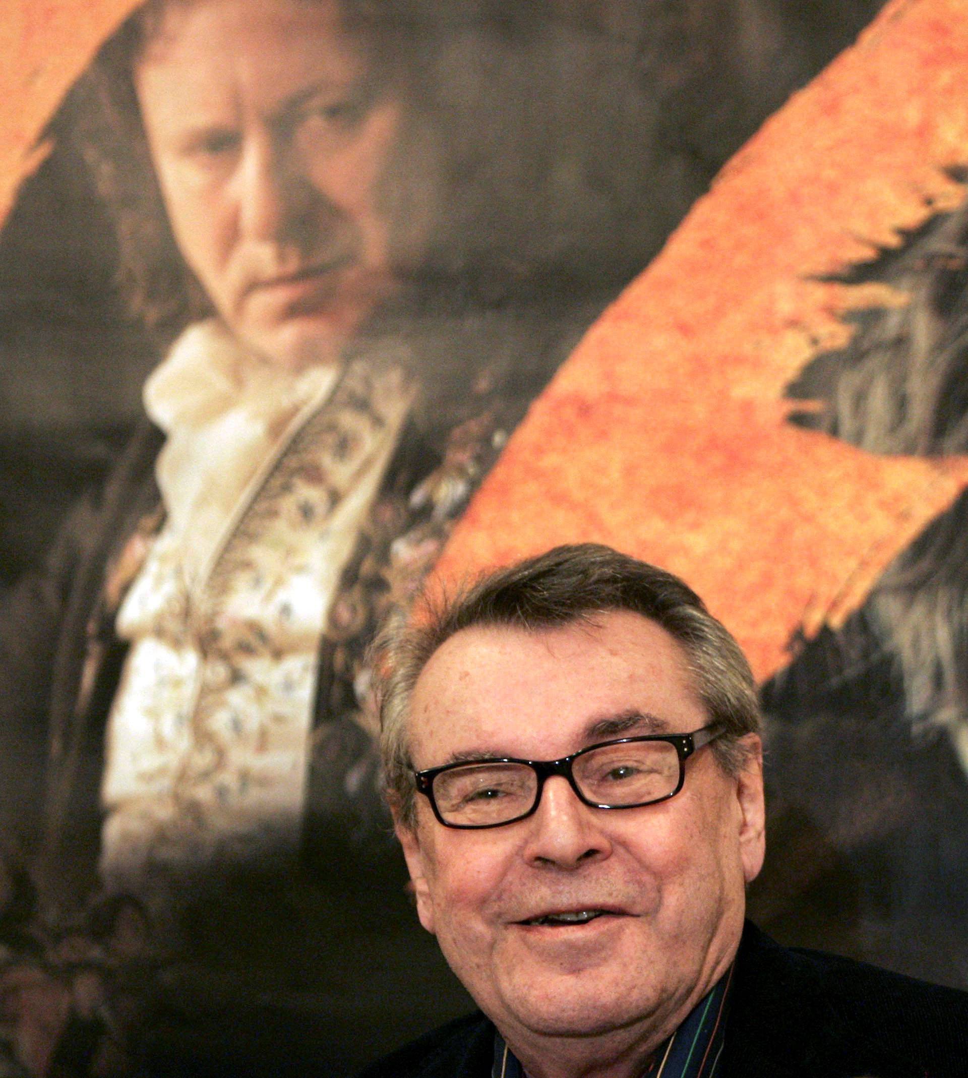 FILE PHOTO: Czech director Milos Forman smiles during a news conference in Prague