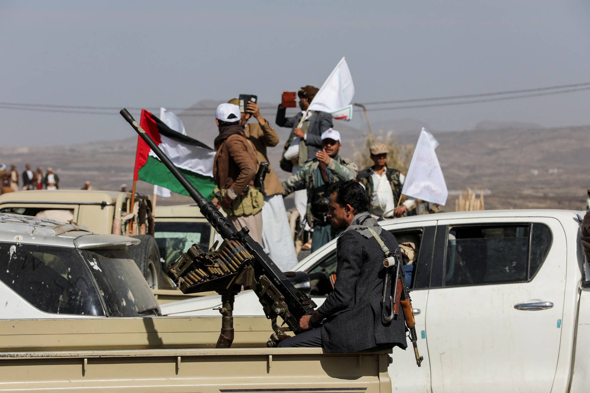 Houthi tribesmen gather to show defiance after U.S. and U.K air strikes on Houthi positions near Sanaa