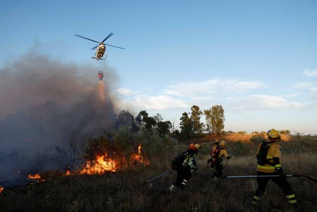 A wildfire burns on the outskirts of Valmojado