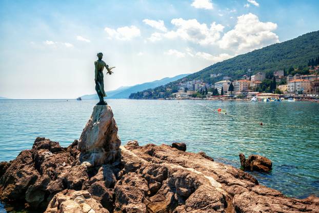 Statue of Maiden with seagull in Opatija, Croatia.
