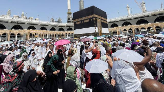 Muslim pilgrims circle the Kaaba and pray at the Grand Mosque in the holy city of Mecca, Saudi Arabia