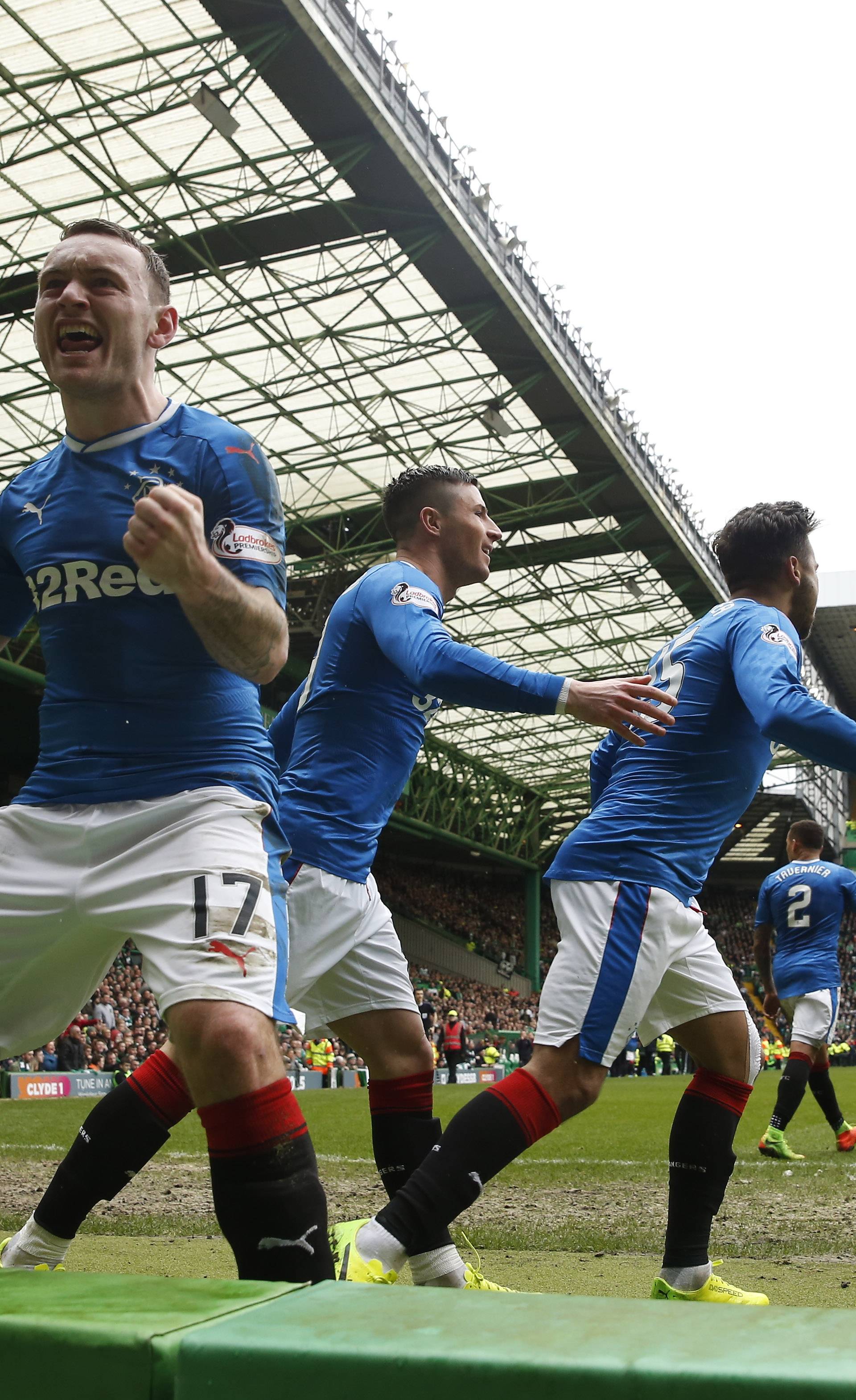 Rangers' Lee Hodson celebrates their first goal scored by Clint Hill with teammates