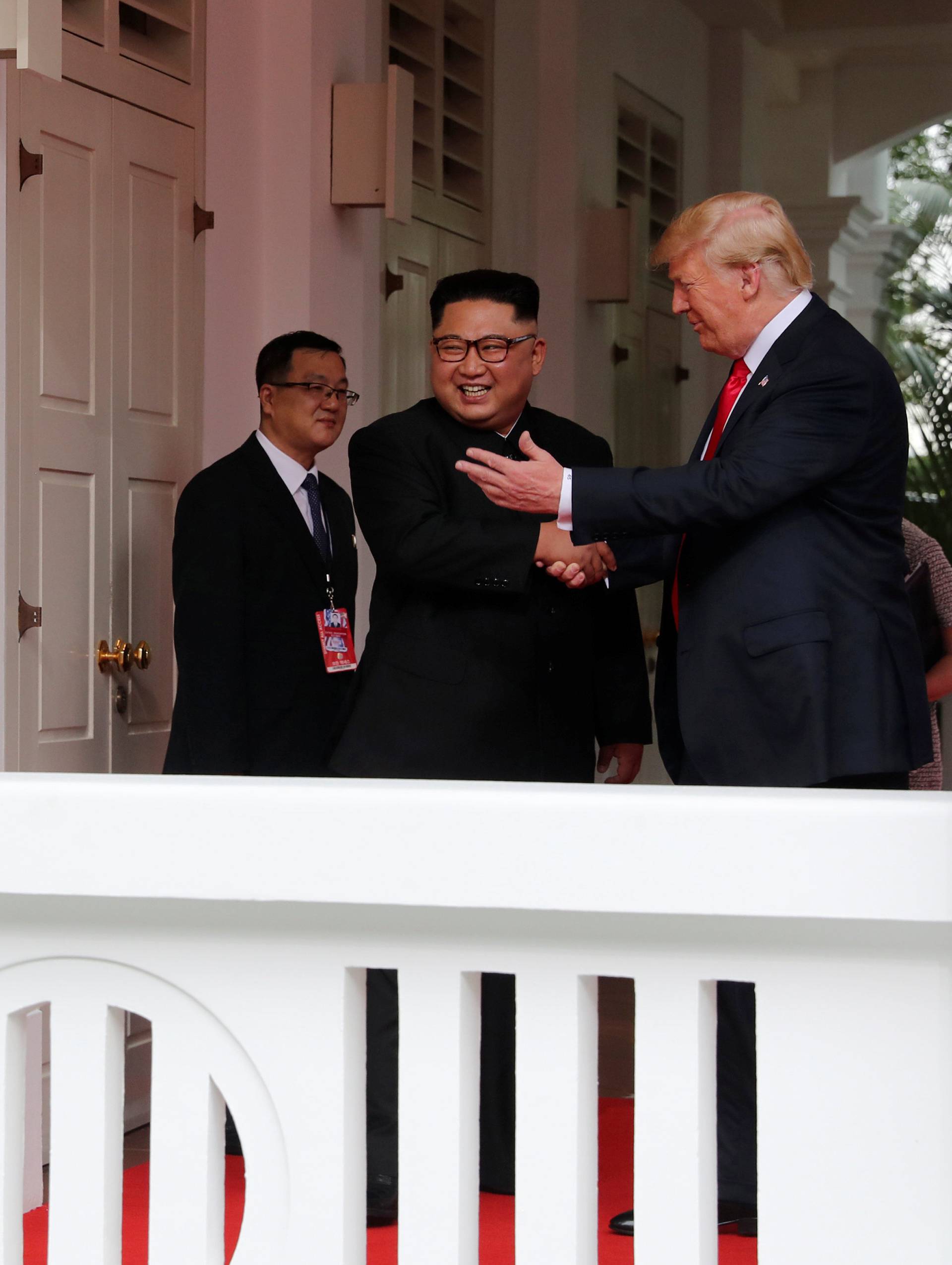 U.S. President Donald Trump shakes hands with North Korea's leader Kim Jong Un at the Capella Hotel in Singapore