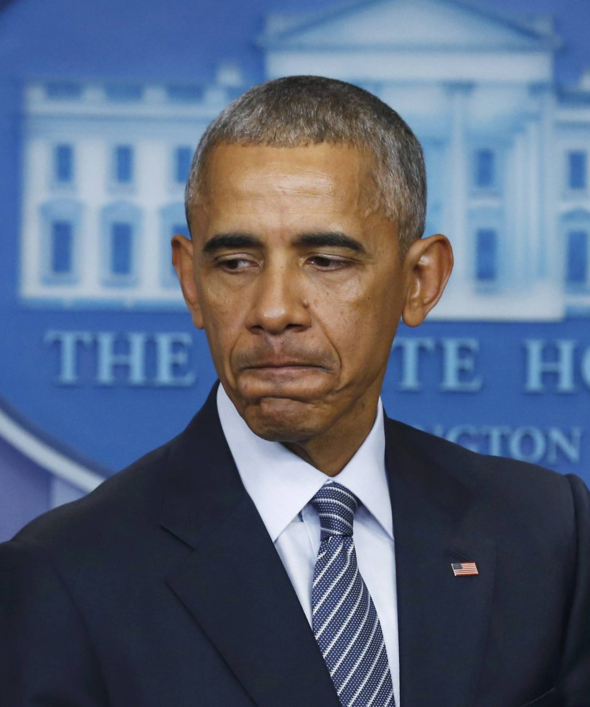 U.S.  President Obama pauses during news conference at the White House in Washington