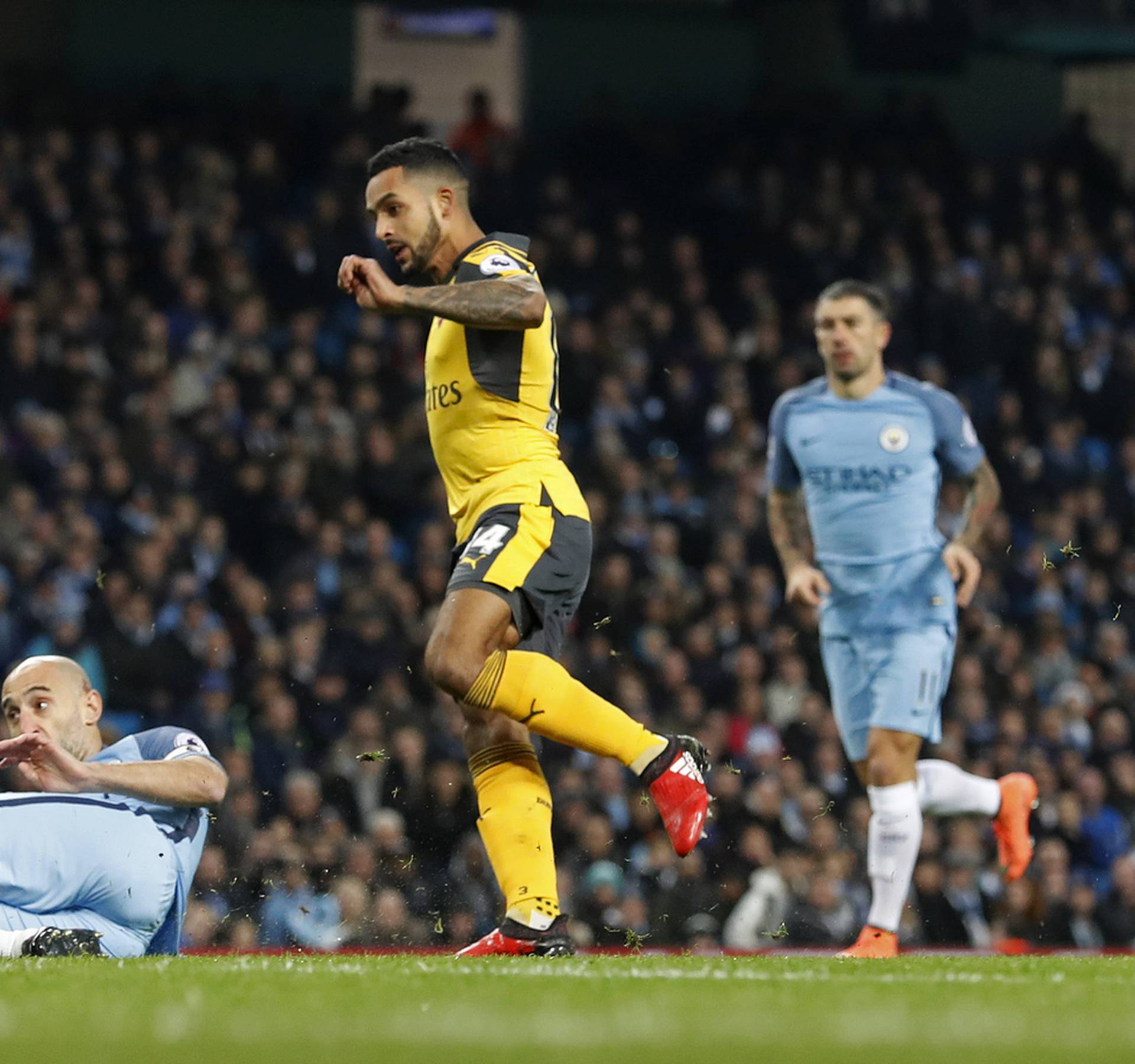 Arsenal's Theo Walcott scores their first goal