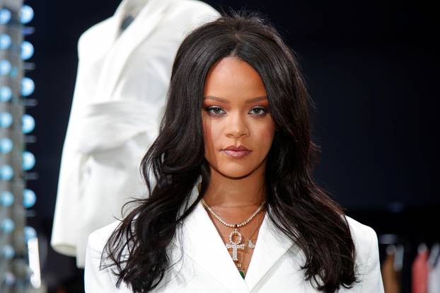 Pop superstar Rihanna poses in a pop-up store to present her first collection with LVMH for the new label, Fenty, in Paris