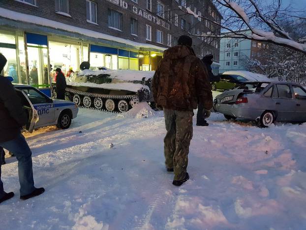 A view shows the scene of an incident involving an armoured personnel carrier which was rammed by a man into a shop window before climbing through the rubble to steal a bottle of wine, in the northern town of Apatity