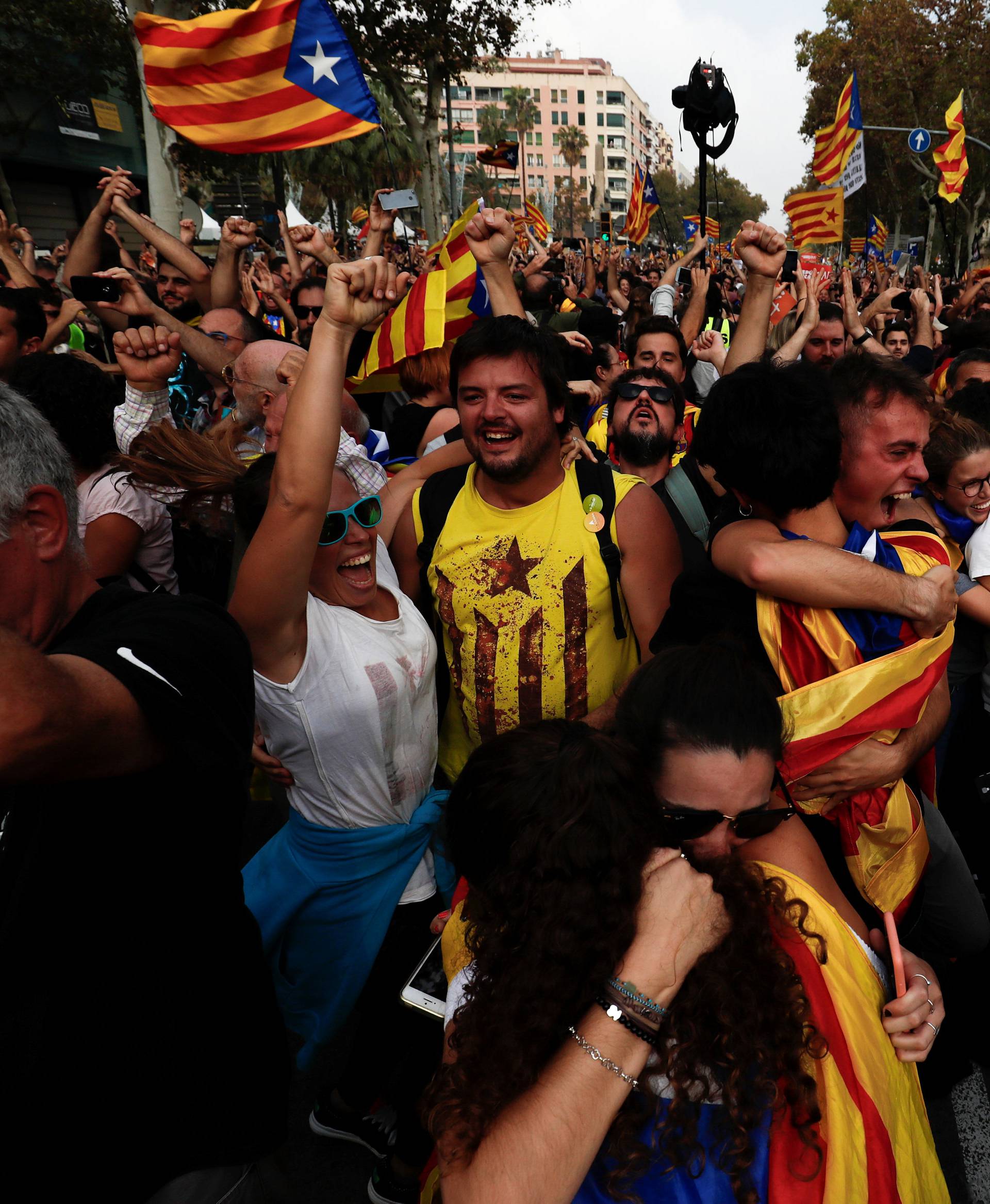 People celebrate after the Catalan regional parliament declares the independence from Spain in Barcelona