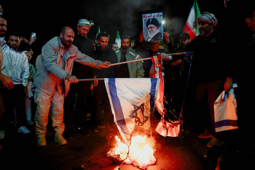 People gather after a two-week ceasefire in the Iran war was announced, in Tehran