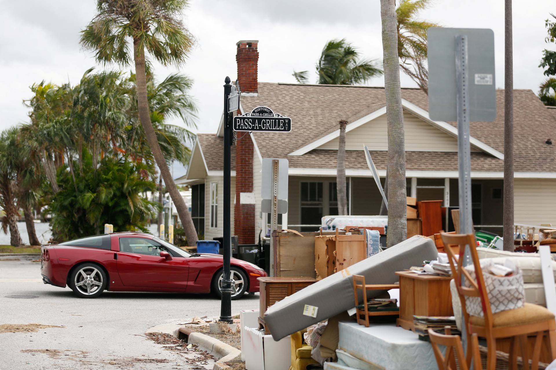 Debris from Hurricane Helene is seen on the roadside as residents evacuate before the arrival of Hurricane Milton, in St. Pete Beach, Florida