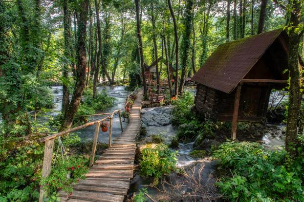 Turquoise color of water in the summer on the river Janj