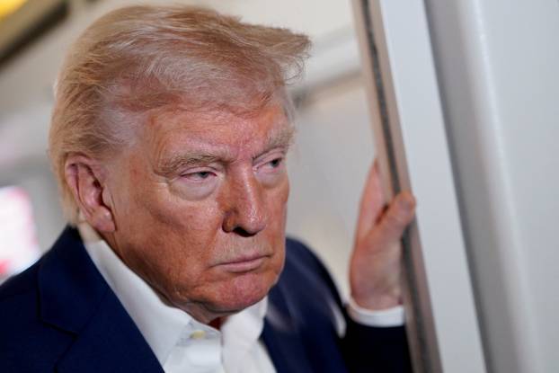 U.S. President Donald Trump on board Air Force One on the way to Palm Beach International Airport