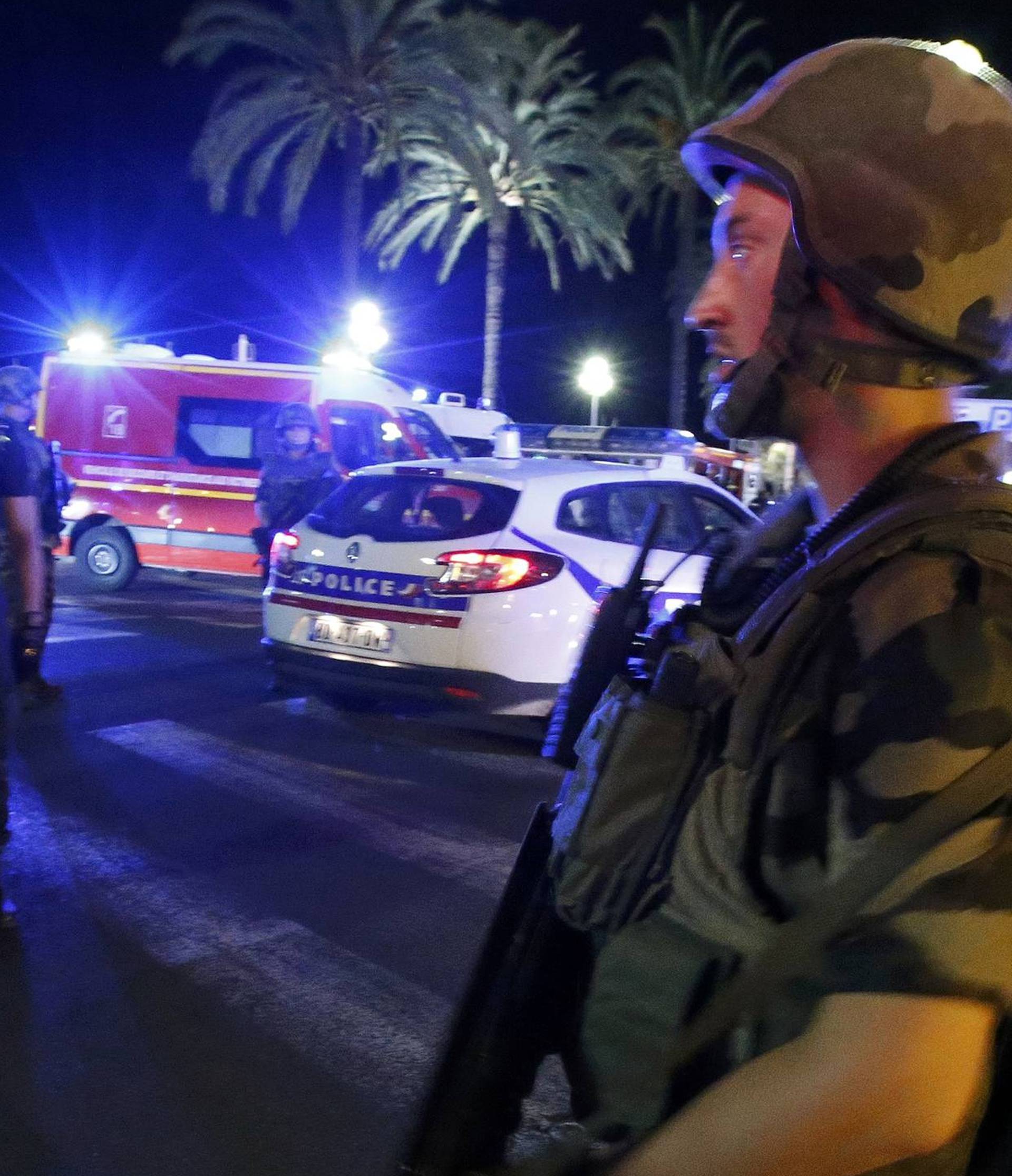French soldiers cordon the area after at least 30 people were killed in Nice when a truck ran into a crowd celebrating the Bastille Day national holiday