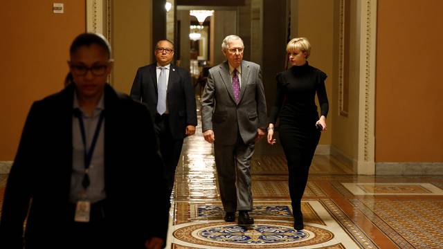 Senate Majority Leader Mitch McConnell (R-KY) walks to the Senate floor before a vote to end a government shutdown in Washington