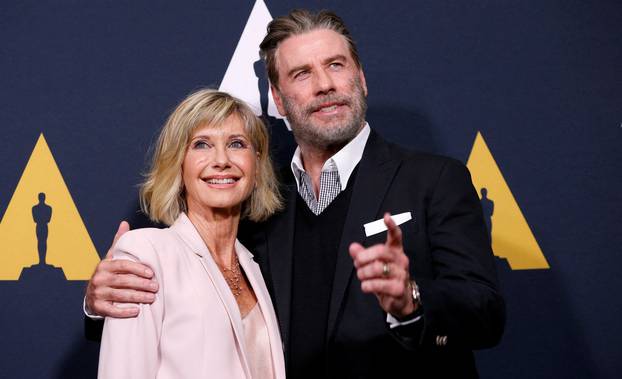 FILE PHOTO: Cast members Travolta and Newton-John pose at a 40th anniversary screening of "Grease" at the Academy of Motion Picture Arts and Sciences in Beverly Hills