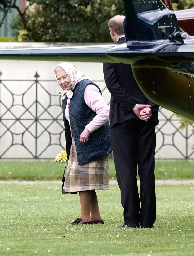 The Queen arrives at Kensington Palace by helicopter to meet Prince Louis for the first time as she brings a hand-picked bouquet of flowers as a gift for the Duchess of Cambridge