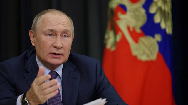 FILE PHOTO: Russian President Vladimir Putin chairs a meeting via video link in Sochi