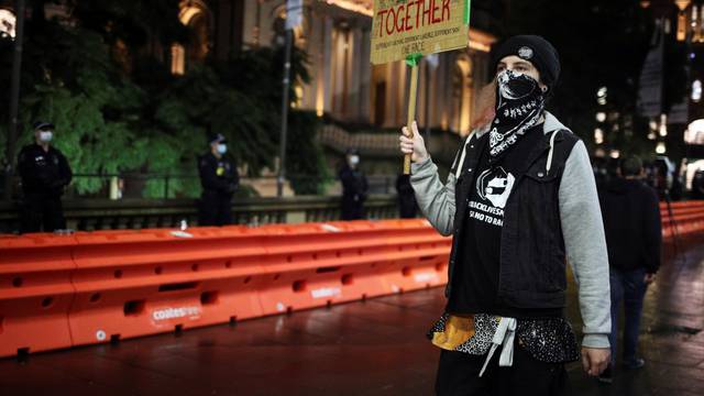 People demonstrate in solidarity with the Black Lives Matter protests, in Sydney