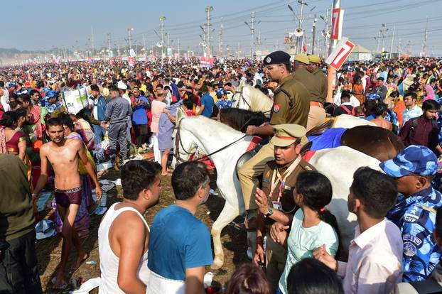 Devotees take a dip at Sangam during "Maha Kumbh Mela" in Prayagraj