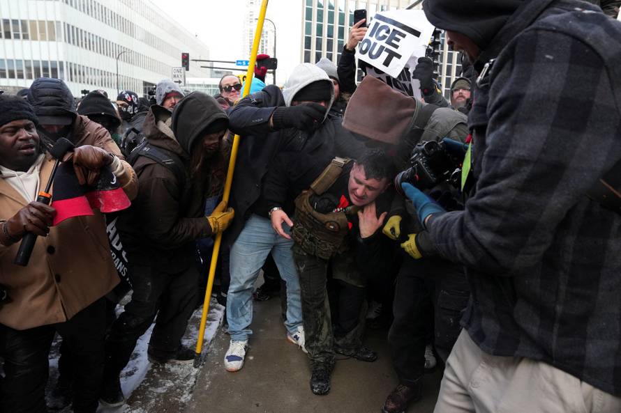 People attend the "March Against Minnesota Fraud" in Minneapolis