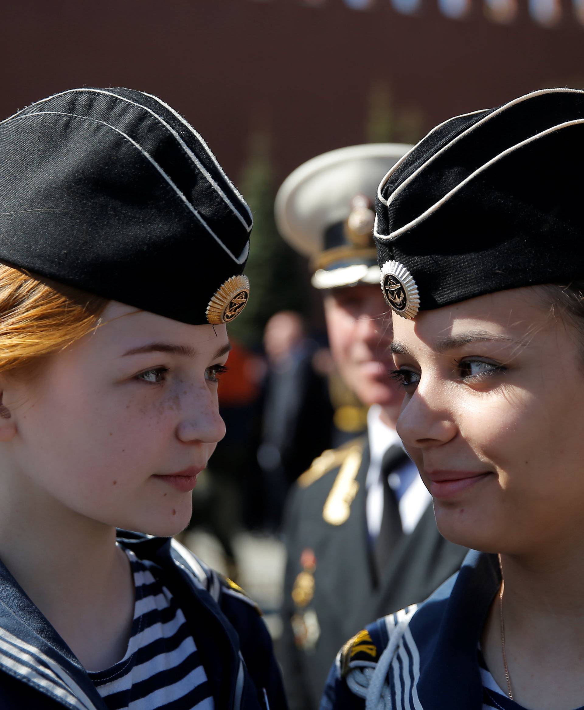 People attend the Victory Day celebrations during the Victory Day parade at Red Square in Moscow