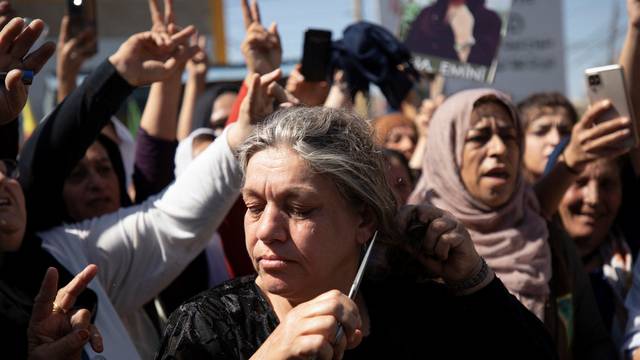 Women protest over the death of Mahsa Amini in Iran, in the Kurdish-controlled city of Qamishli