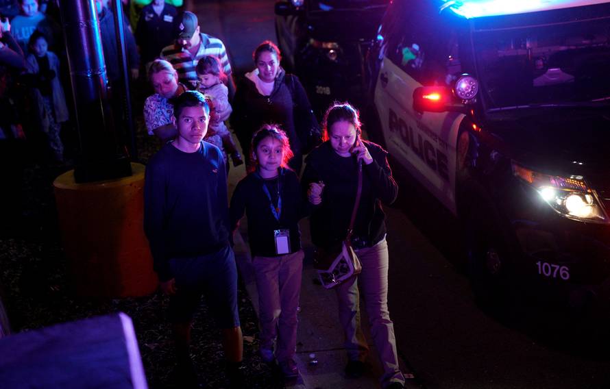 Families who were shopping during a  a shooting at a Walmart leave the scene in Thornton