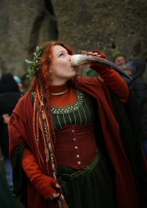 Winter solstice celebrations during sunrise at Stonehenge