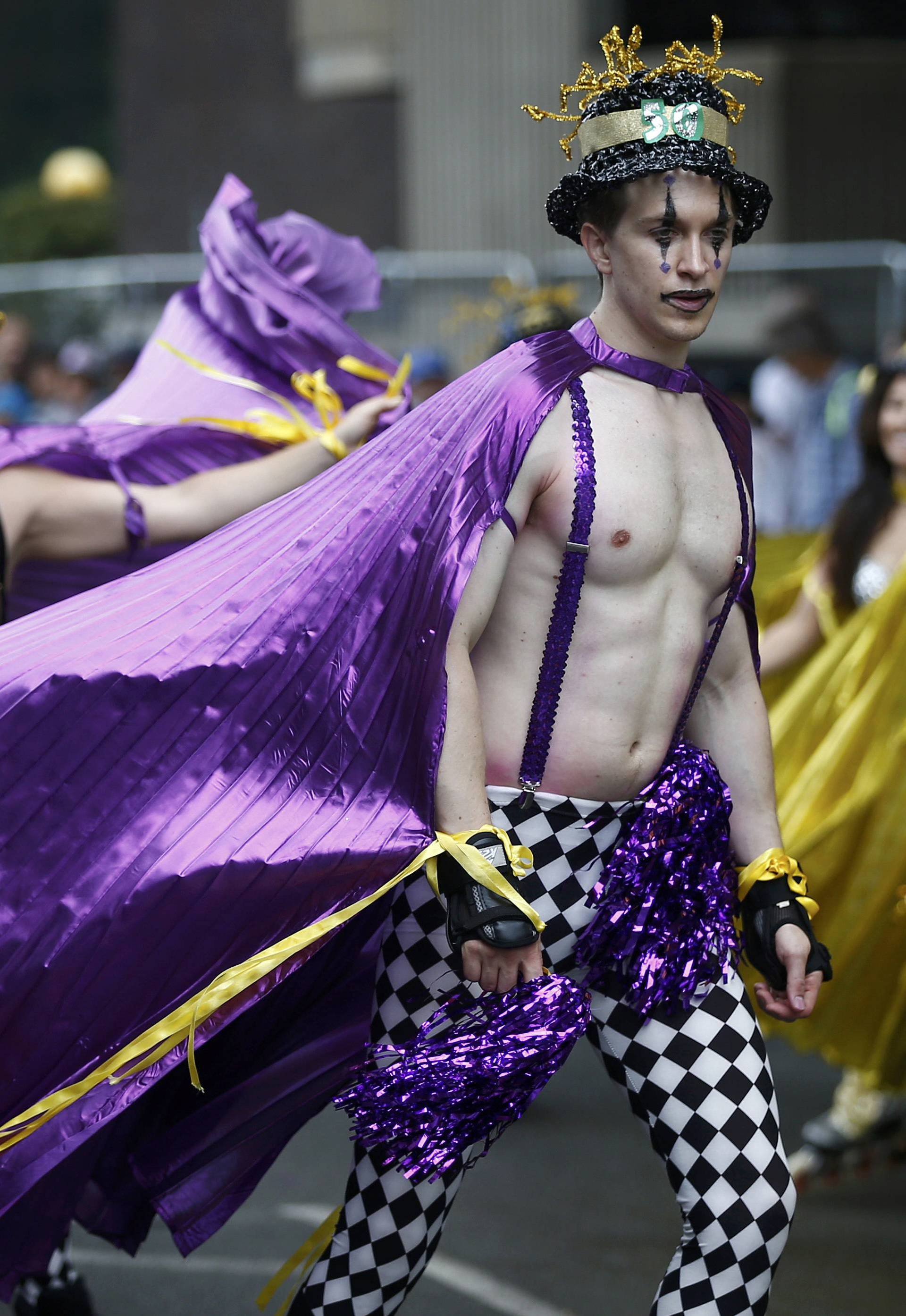 Performers participate in the children's day parade at the Notting Hill Carnival in London