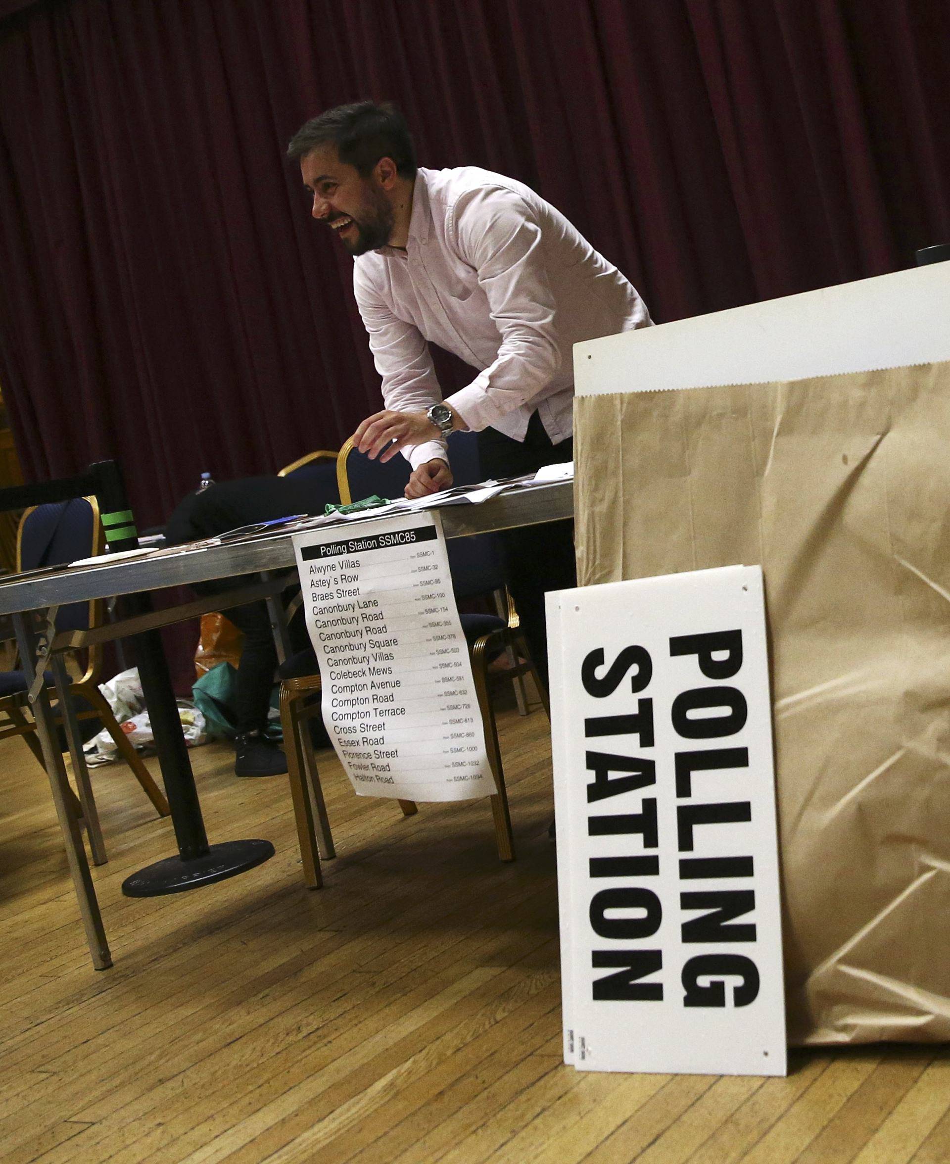 An electoral worker prepares up a polling station for the Referendum on the European Union in north London