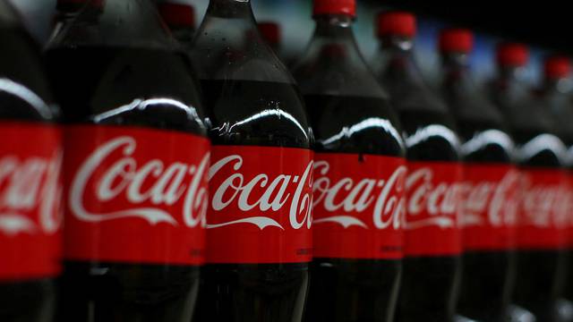 FILE PHOTO: Coca-cola soda is shown on display during a preview of a new Walmart Super Center prior to its opening in Compton, California,