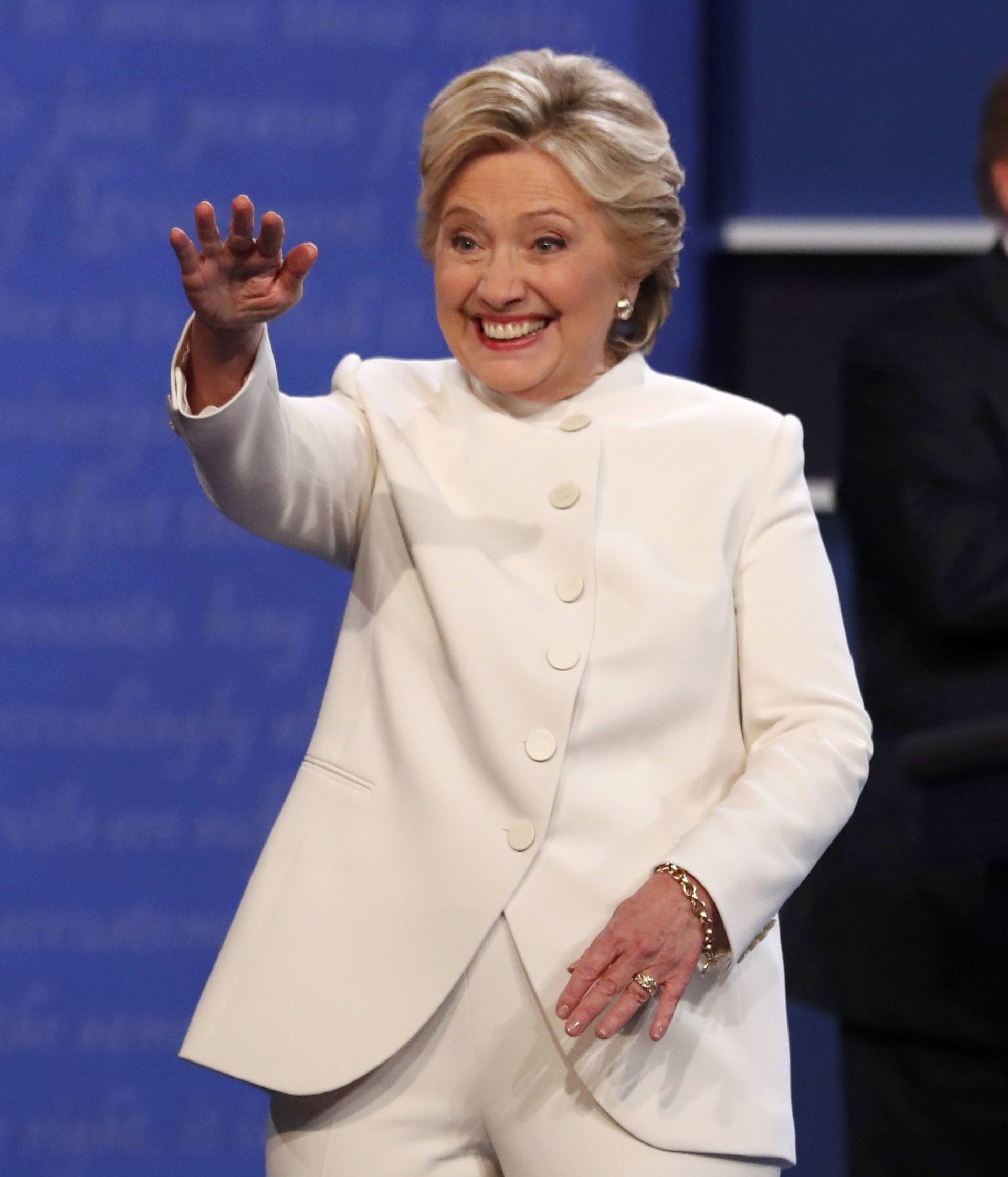 Democratic U.S. presidential nominee Clinton walks off the debate stage as Republican U.S. presidential nominee Trump remains at his podium after the conclusion of their third and final 2016 presidential campaign debate in Las Vegas