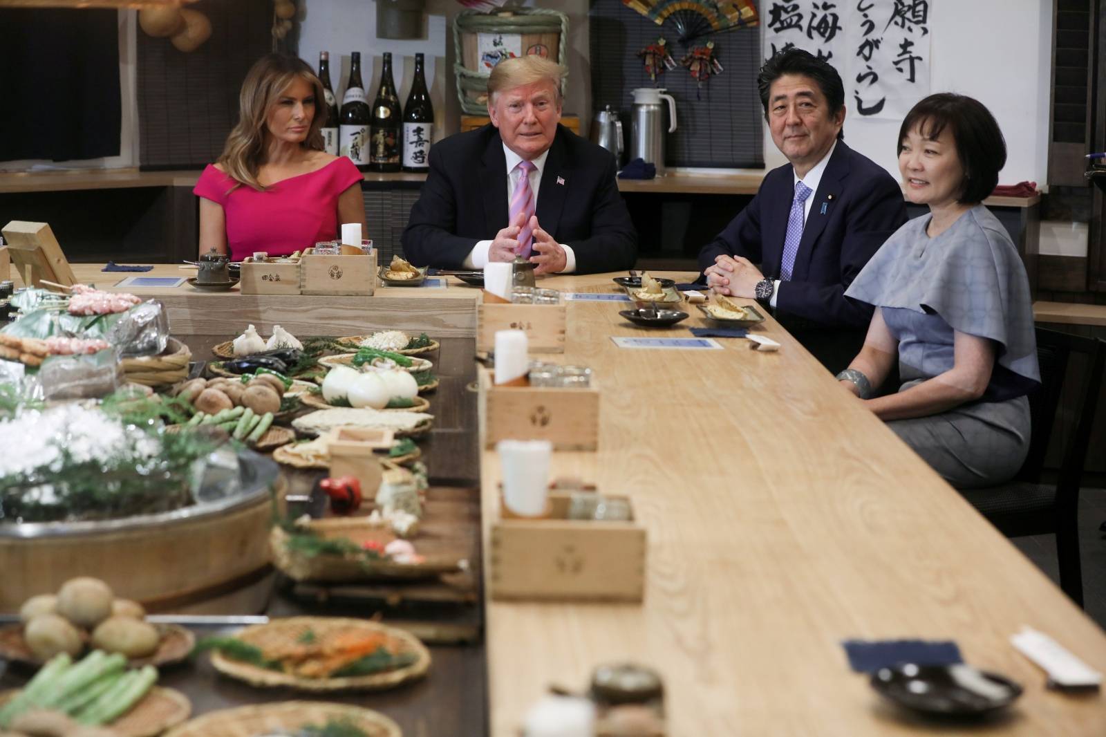 Japanese Prime Minister Abe and his wife sit down with U.S. President Donald Trump and the first lady for a couples dinner in Tokyo