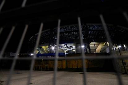 People gather to mourn the death of Argentine soccer legend Diego Maradona, in Naples