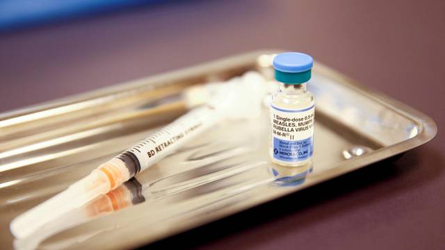FILE PHOTO: FILE PHOTO: A vial of the measles, mumps, and rubella (MMR) vaccine is pictured at the International Community Health Services clinic in Seattle