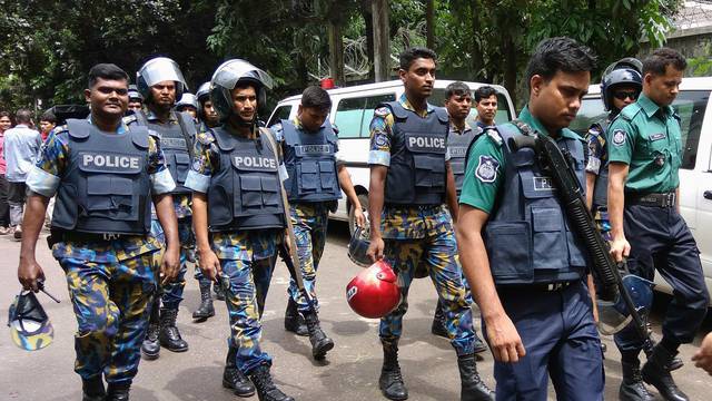 Security personnel are seen near the Holey Artisan restaurant hostage site, in Dhaka, Bangladesh