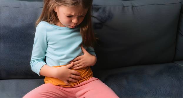 Caucasian little girl suffering from abdominal pain