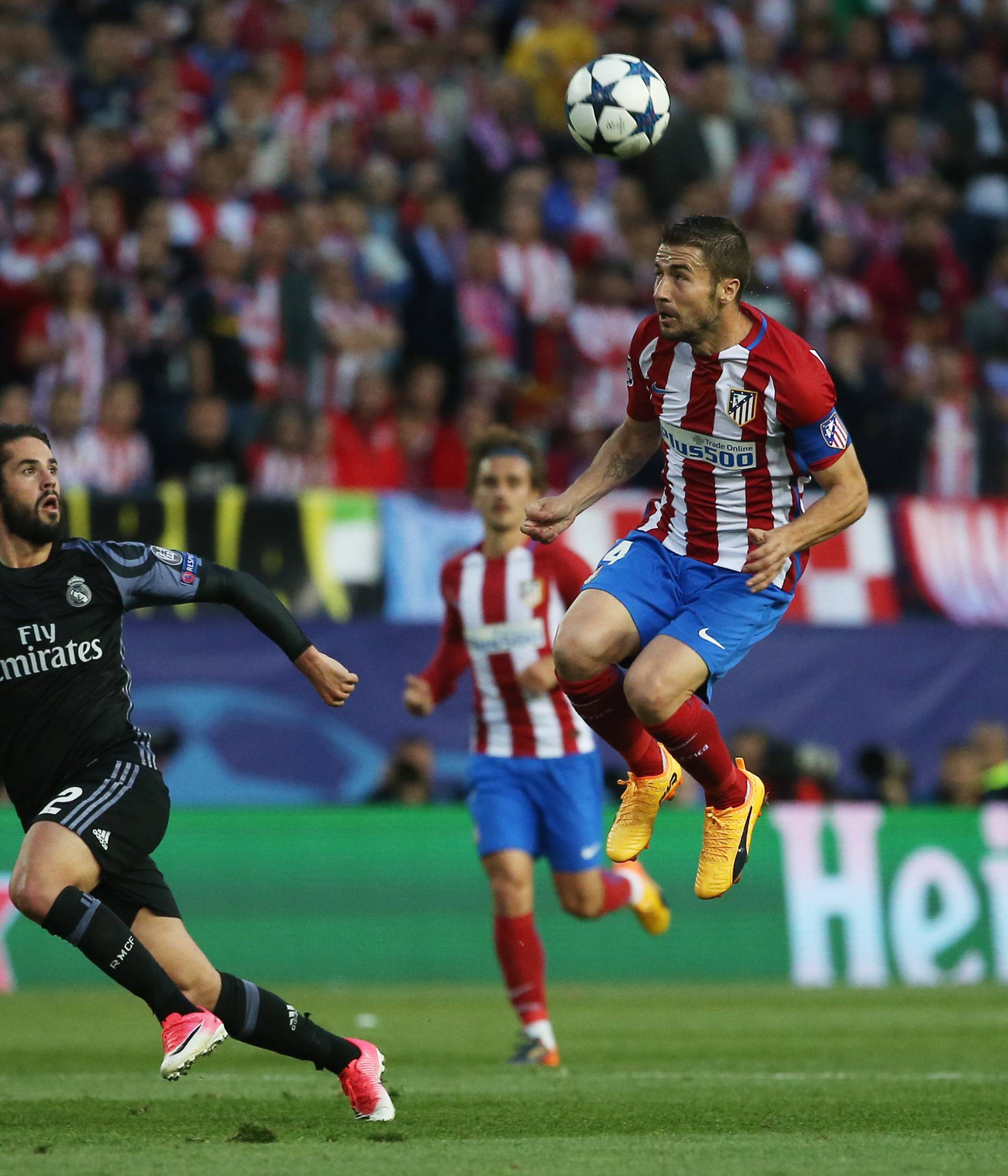 Atletico Madrid's Gabi in action with Real Madrid's Isco