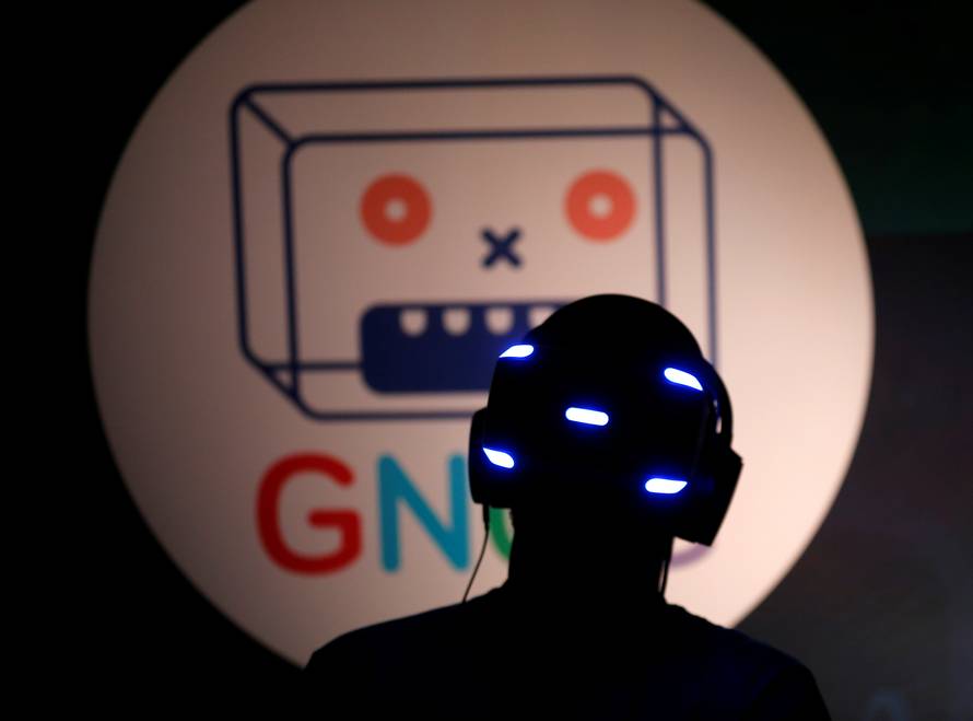 People try the new Sony VR headset during Sony Corporation's PlayStation 4 E3 2016 event in Los Angeles