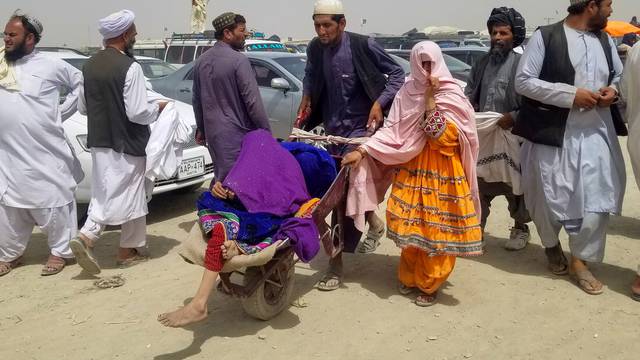 People cross Friendship Gate at Pakistan-Afghanistan border town of Chaman