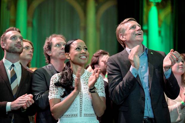 Swedish Green Party (Miljoepartiet) candidate Alice Bah Kuhnke and Per Bolund, Minister for Financial Markets and Housing, applaud at the party