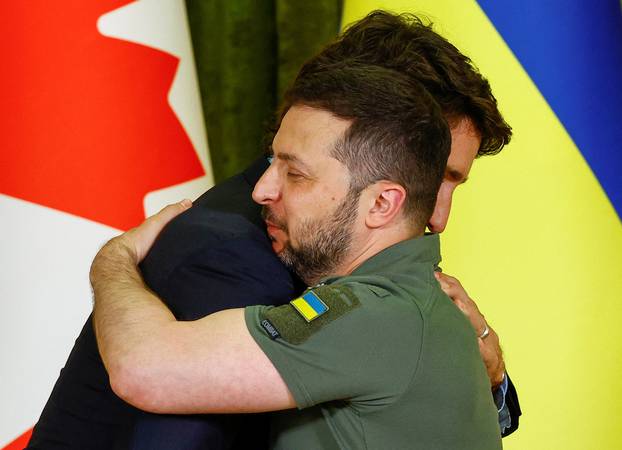 Canadian Prime Minister Trudeau and Ukraine's President Zelenskiy embrace during press conference in Kyiv