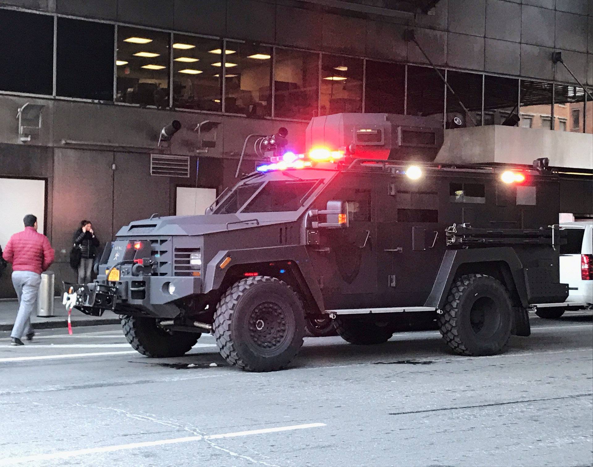 An armoured police truck occupies the street outside of the New York Port Authority in New York City after reports of an explosion