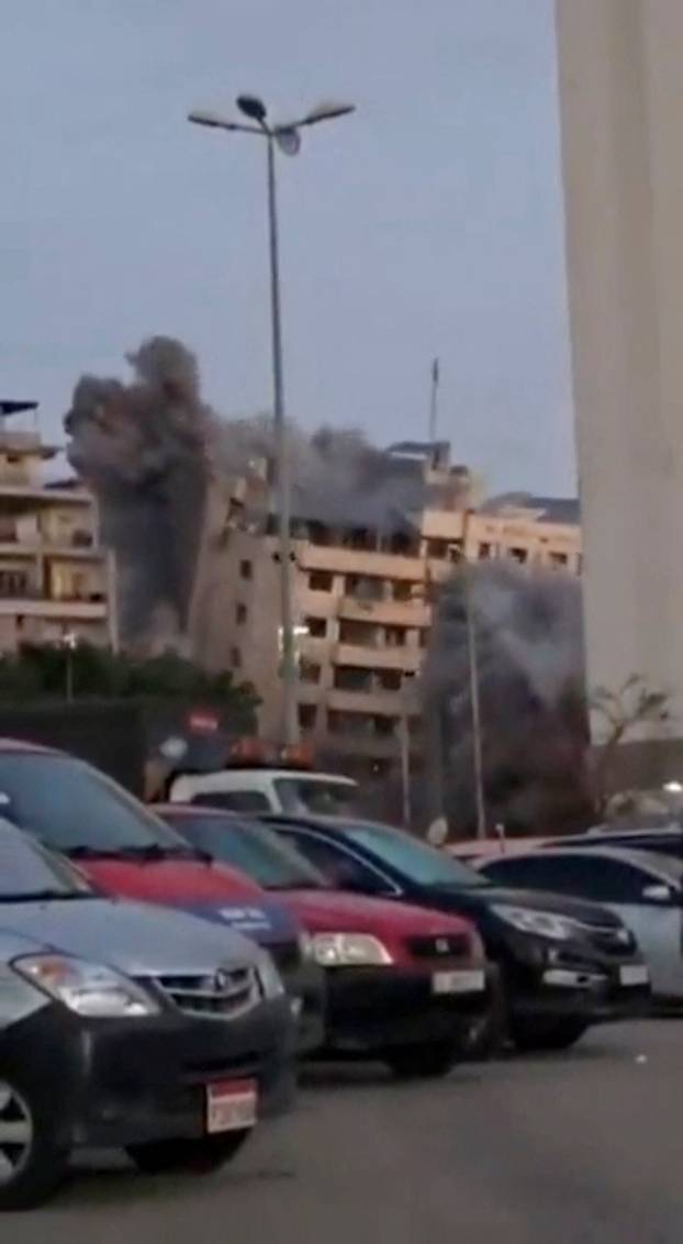 A building collapses after it was struck by an Israeli airstrike in Beirut's Bachoura neighbourhood